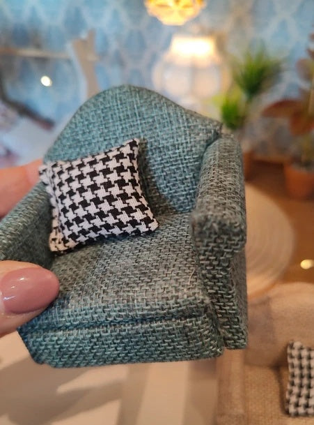 Fauteuil vert et coussin