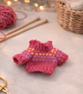 Pull rose foncé en tricot