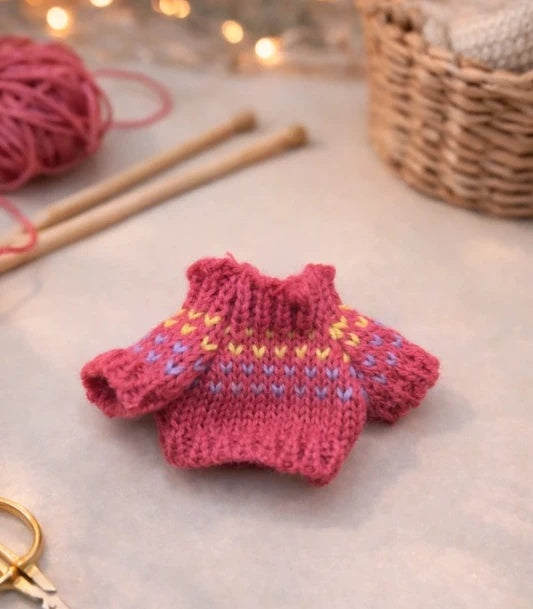 Pull rose foncé en tricot