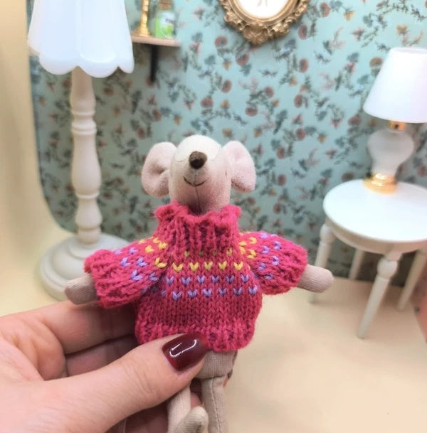 Pull rose foncé en tricot