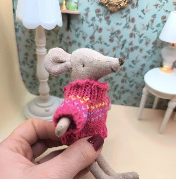 Pull rose foncé en tricot