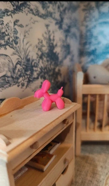 Petit chien rose décoratif