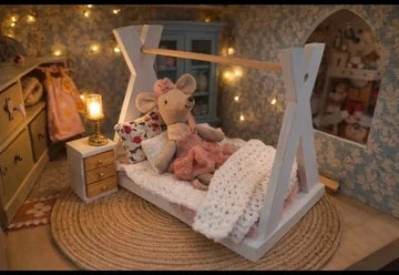 Lit cabane et sa literie