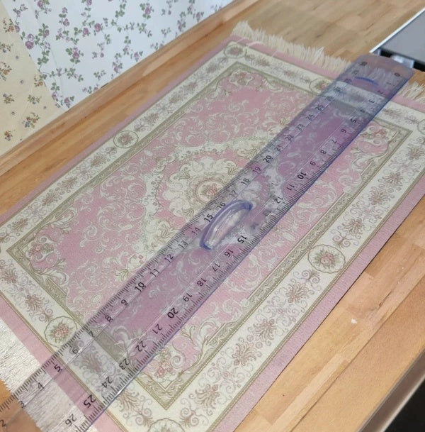 Grand tapis à frange rose