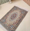 Petit tapis à franges marron