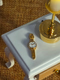 Petite montre miniature pour maison de poupee 1/12eme