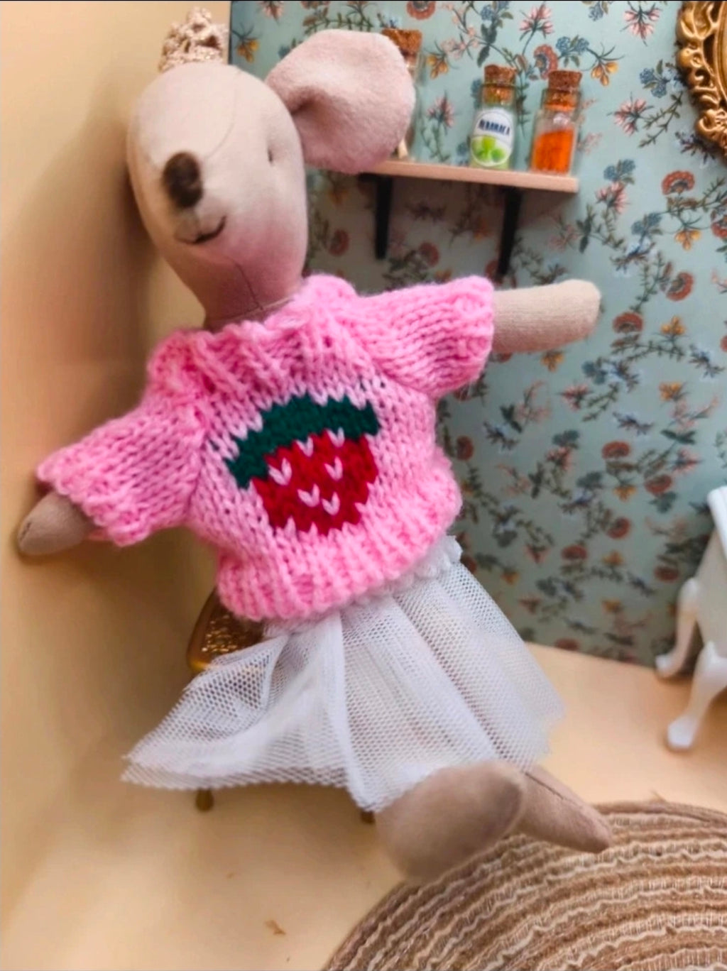 Pull tricoté à motifs fraise